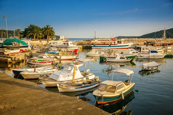 Beautiful seascape with small old boats and yachts in the port of Herceg Novi, Montenegro