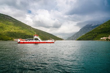 Beautiful landscape with regular passenger ferry from Lepetane to Kamenari in Montenegro