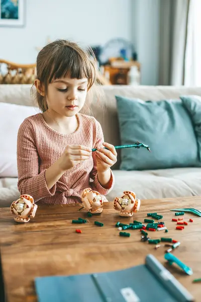 Cute Little Girl Arranging Small Colorful Construction Pieces Wooden Table Stock Picture