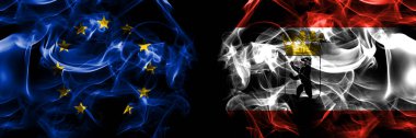 Flags of EU, European Union vs Germany, Berlin, state. Smoke flag placed side by side on black background. 