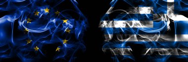 Flags of EU, European Union vs Greece, Greek. Smoke flag placed side by side on black background. 