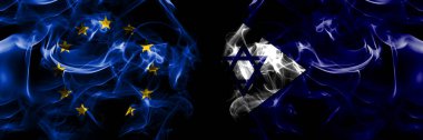 Flags of EU, European Union vs Israel, Naval Ensign. Smoke flag placed side by side on black background. 