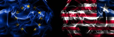Flags of EU, European Union vs Liberia, Liberian. Smoke flag placed side by side on black background. 