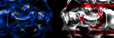 Flags of EU, European Union vs Northern Cyprus. Smoke flag placed side by side on black background. 
