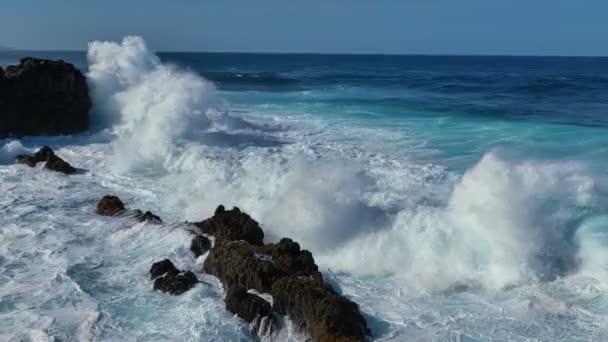 Slow Motion Aerial Shot Ocean Wave Breaks Coastal Rocks Forming — Stockvideo
