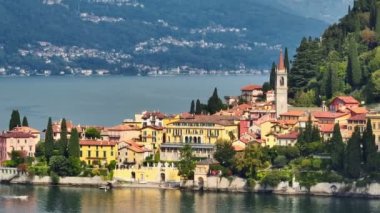 Aerial view of Varenna, Lake Como, Italy. Summer luxury tourism landmark romantic honeymoon travel destination. Orange roofs of old town with the church of San Giorgio in the central square