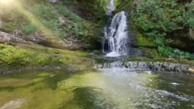 Waterfall in the mountains. River in the forest with cascading waterfalls. Gimbal slow motion shot 2