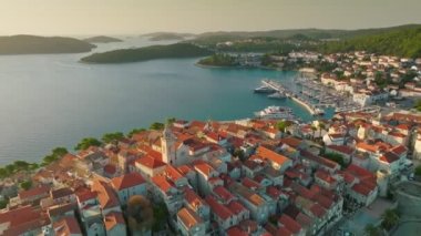 Aerial sunrise view of Korcula old town on Korcula island, Croatia. Magnificent islands in the Adriatic Sea, travel destination. Flying over medieval mediterranean Croatian town of Korcula 2
