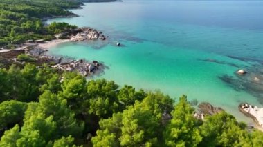 Beautiful orange beach Kavourotripes, Sitonia, Halkidiki, Greece. Aerial shot of lagoon with turquoise water, sandy beach and pine trees