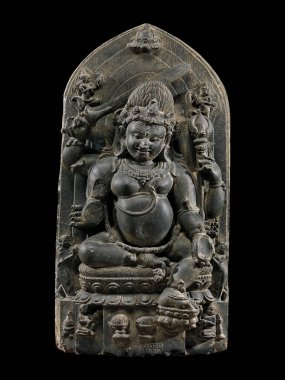 Ancient stone sculpture of Mahakala deity from 11th-12th century Bihar, India, showcasing intricate carving and historical craftsmanship. clipart