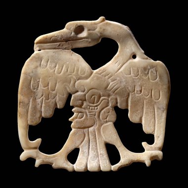 A meticulously carved ancient Maya bird ornament 600-800 CE, likely bone or shell, showcasing intricate Pre-Columbian Mesoamerican artistry and cultural symbolism. 