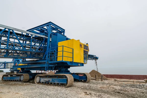 Industrial belt conveyor moving raw materials from mine. High quality photo