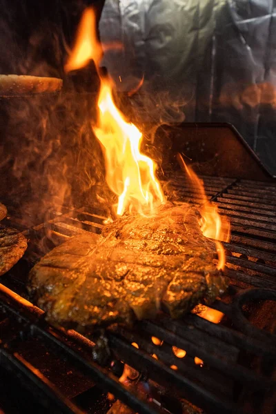 Stock image Beef steak on the grill with flames. High quality photo