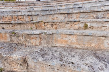 Close-up view of the stone steps of the ancient theater in Ohrid. clipart