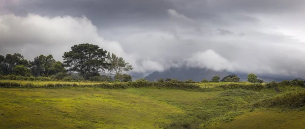 Striking Storm Clouds over Rolling Hills.in Asturias, Spain