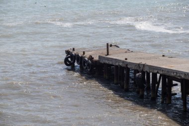Landscape seashore, sea pier in clear weather.