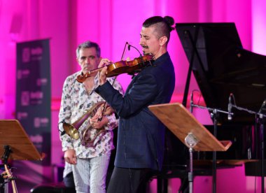 Cracow, Poland - July 4, 2022: Adam Baldych Quartet and Paolo Fresu live on stage of  Krakow Philharmonic at Summer Jazz Festival in Cracow, Poland 