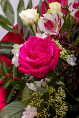 beautiful florist bouquet of roses and freesias