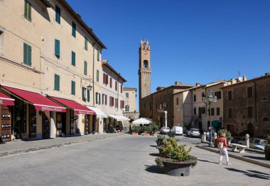 Montalcino, Italy - September 12, 2022: Piazza Garibaldi and Palazzo dei Priori in Hilltop town of Montalcino,Tuscany,Italy