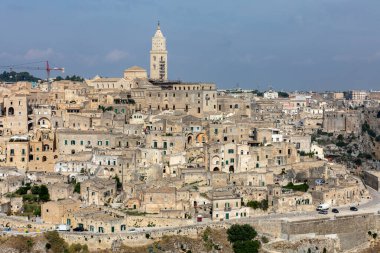 Matera, Italy - September 19, 2019: Panoramic view of Sassi di Matera a historic district in the city of Matera, well-known for their ancient cave dwellings from the Belvedere di Murgia Timone,  Basilicata, Italy 