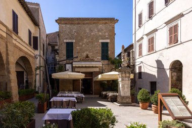 Pitigliano, Italy - September 13, 2022: the picturesque medieval town founded in Etruscan time on the tuff hill in Tuscany, Italy.