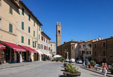 Montalcino, Italy - September 12, 2022: Piazza Garibaldi and Palazzo dei Priori in Hilltop town of Montalcino,Tuscany,Italy