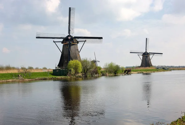 stock image The windmills at Kinderdijk, the Netherlands, a UNESCO world heritage site. Built about 1740 system19 windmills is part of a larger water management system to prevent flooding.