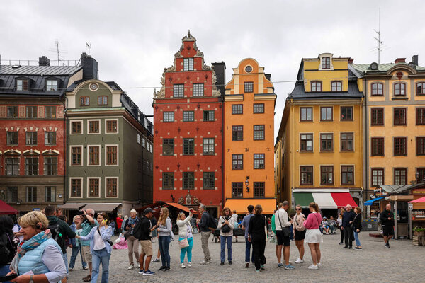 Stockholm, Sweden - July 26, 2023: Stortorget, the big square, in Gamla Stan, old town, with traditional colorful old buildings