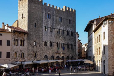 Massa Marittima, Italy - Sept 11, 2022: Garibaldi square and Palazzo del Podesta in Massa Marittima. Italy