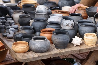 Cracow, Poland - April 11, 2023: Handmade imitations of medieval ceramic vessels in knight camp at the festival of historical reconstruction clipart