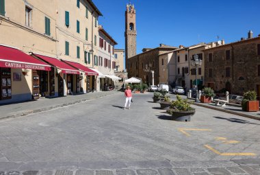Montalcino, Italy - September 12, 2022: Piazza Garibaldi and Palazzo dei Priori in Hilltop town of Montalcino,Tuscany,Italy