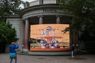 Venice, Italy - May 7 2024: Foreigners Everywhere 60th Venice Art Biennale in Venice. Visual and sound installation by Julien Creuzet inspired by Caribbean motifs in the French Pavilion at Giardini clipart