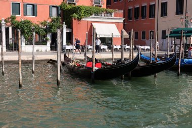 Venice, Italy - September 5, 2022: Moored gondolas on the Grand Canal in Venice, Italy clipart