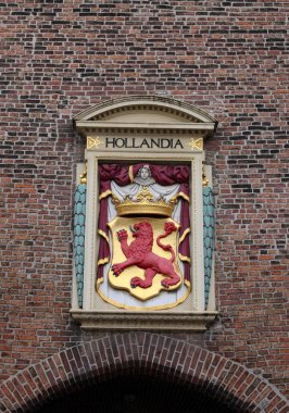 Coat of Arms on the wall The Gevangenpoort, a former gate and medieval prison on the Buitenhof in The Hague, Netherlands clipart