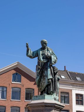 Statue of Laurens Janszoon Coster on the Grote Markt in Haarlem, the Netherlands clipart