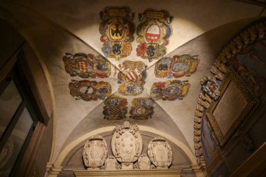 Bologna, Italy - May 9, 2024: Students coats of arms in the Archiginnasio Municipal Library, formerly the main building of the University of Bologna clipart