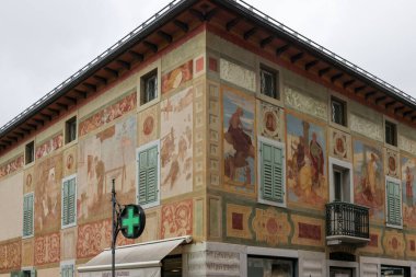 Cortina d Ampezzo, Italy - Sept 6, 2024: Ciasa dei pupe Historic Bulding in Cortina d Ampezzo, formerly the Hotel Aquila Nera on the Corso Italia with Famous Frescoes by Luigi and Giuseppe Ghedina clipart