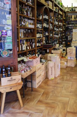 Massa Marittima, Italy - Sept 11, 2022: Interior of a wine shop in Massa Marittima   ,Tuscany, Italy. clipart