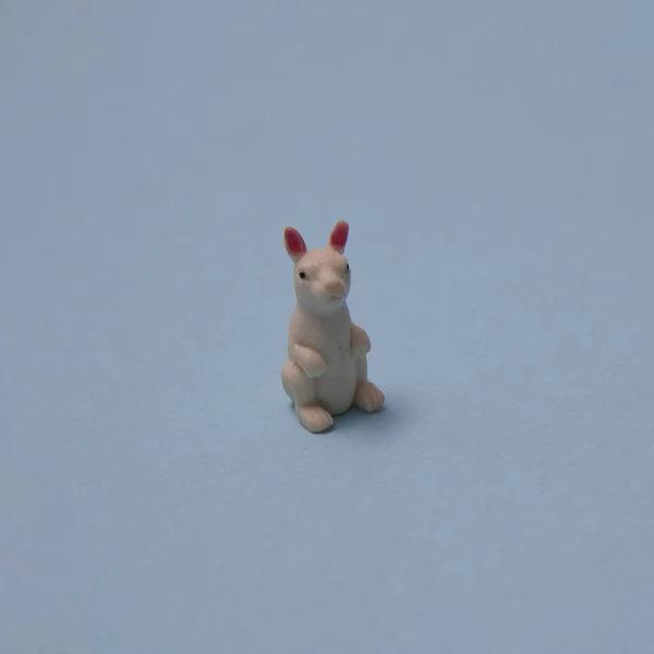 White rabbit on a blue background with copy space. A minimalist Chinese New Year composition.