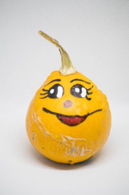 Fun painted gourd with a smiling face clipart