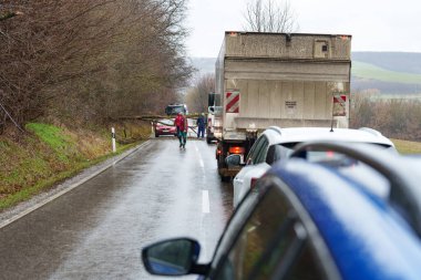 BOSZENFA, HUNGARY - JANUARY 10 2023: Fallen tree blocked the road and   caused congestion on the road Boszenfa. January 10 2023 Boszenfa, Hungary