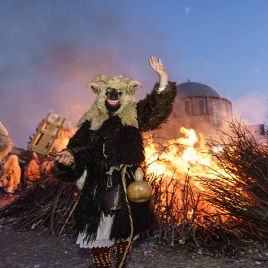 MOHACS, HUNGARY - FEBRUARY 19: Busojaras carnival. Unidentified person wearing mask for spring greetings. February 19, 2023 in Mohacs, Hungary.