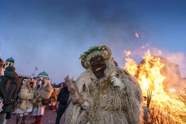 MOHACS, HUNGARY - FEBRUARY 19: Busojaras carnival. Unidentified person wearing mask for spring greetings. February 19, 2023 in Mohacs, Hungary.