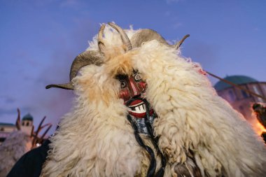 MOHACS, HUNGARY - FEBRUARY 19: Busojaras carnival. Unidentified person wearing mask for spring greetings. February 19, 2023 in Mohacs, Hungary.