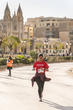 ST. JULIAN'S, MALTA-22 DEC 2024 - Runners take part in an annual public Malta running race 22, December 2024 in St Julian's. clipart