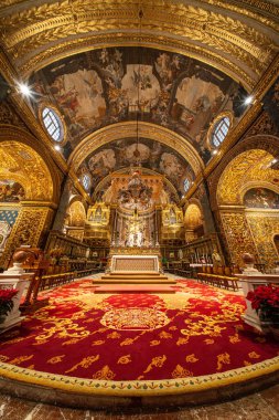 Valletta, Malta - 20 December 2024. Saint John's Co-Cathedral ornated nave. Roman Catholic church in the capital of Malta. Beautiful baroque architecture. clipart