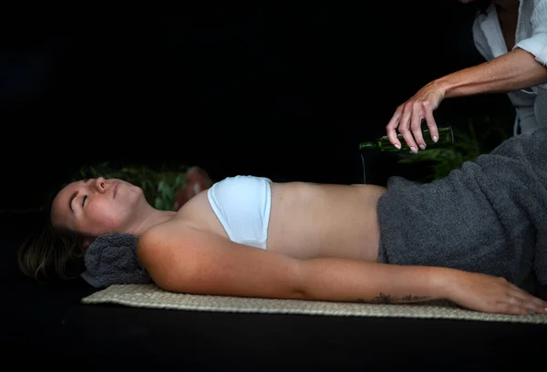 woman and energy healing  in front of black background
