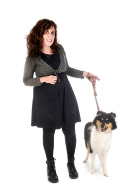 young rough collie and woman in front of white background