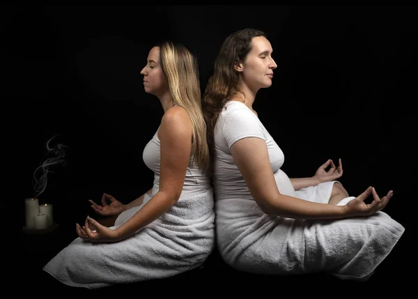 women and energy healing  in front of black background