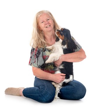 cavalier king charles and woman in front of white background